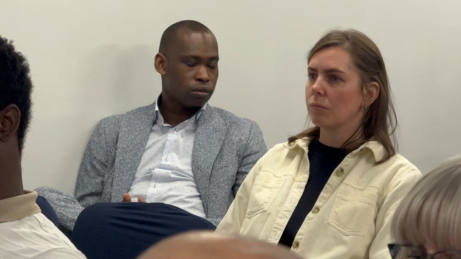 SYBTE team members in conversation during a session