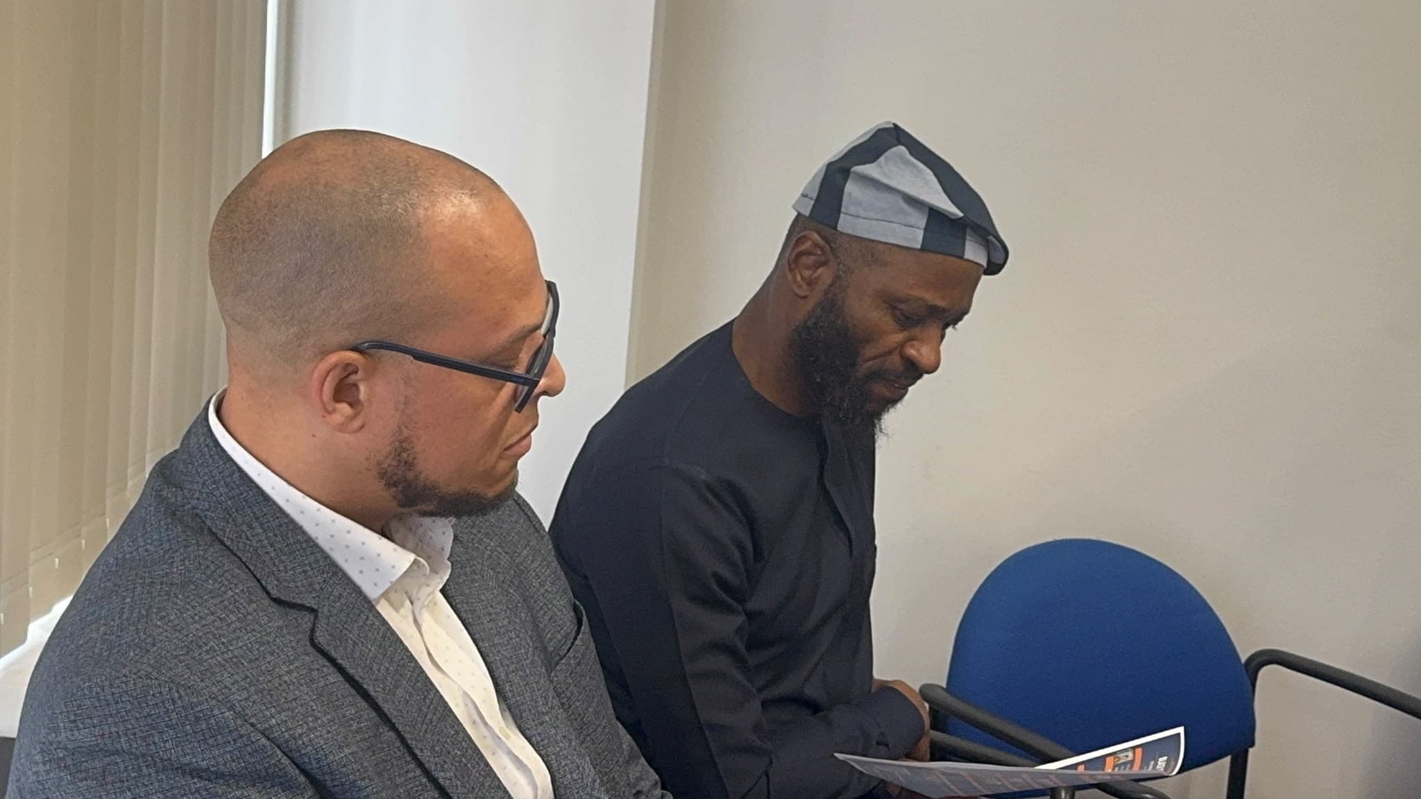 SYBTE community members reviewing a programme at an event